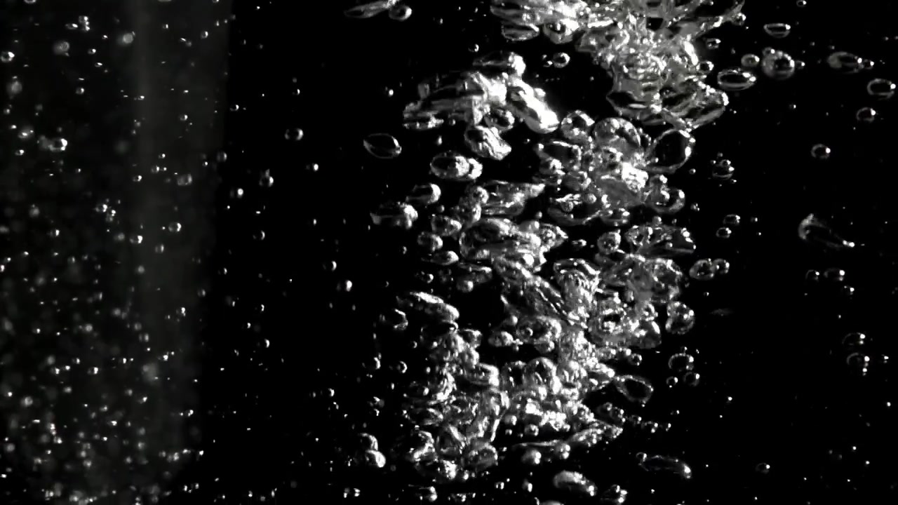 Sparkling Air Bubbles Rising in Dark Water