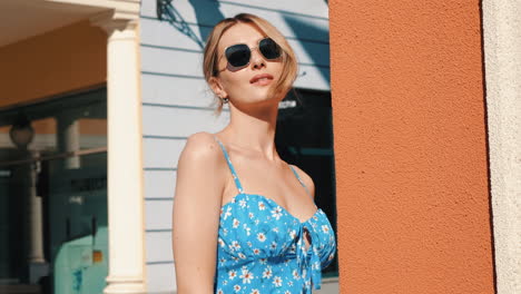 woman in a floral blue dress