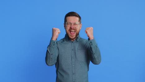 happy mature man celebrating success winning victory lottery jackpot goal achievement good news
