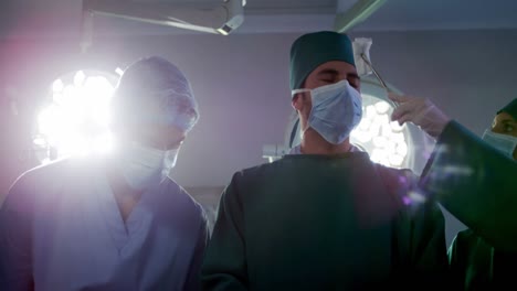 medical team performing operation in operating room