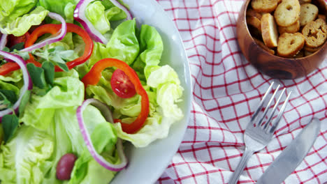 salad with wine on wooden table