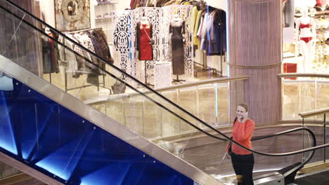 woman talking on the phone in shopping centre