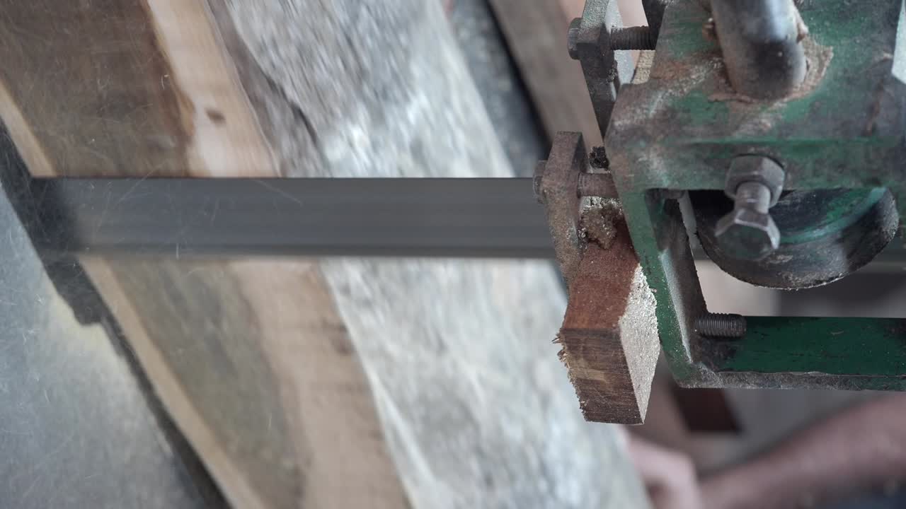 Wood being processed by a band saw