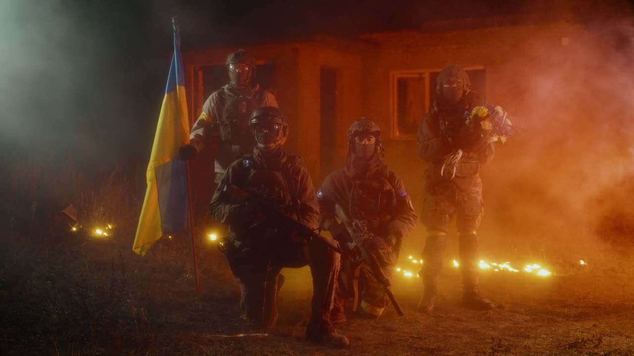 Ukrainian soldiers at a night memorial