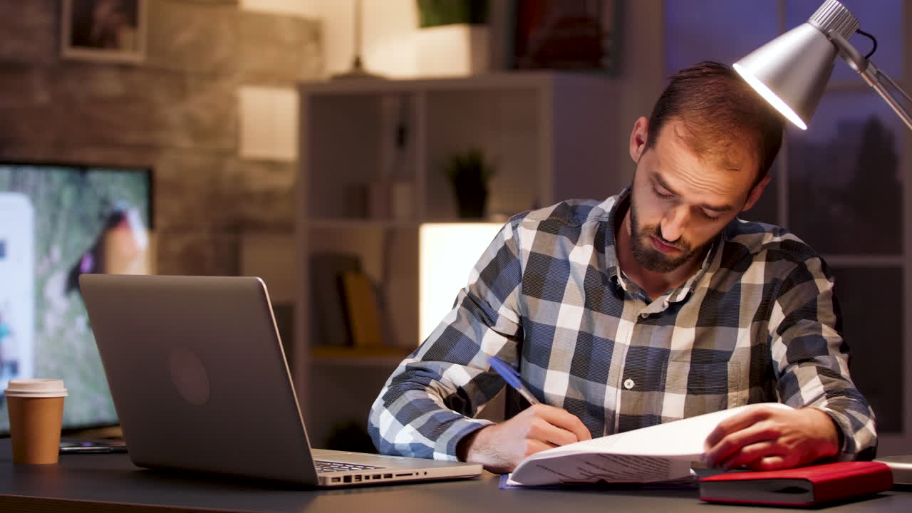 Man working at desk with laptop