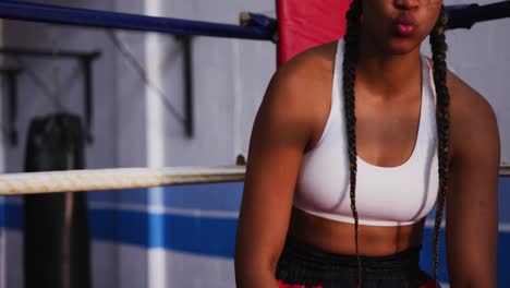 mixed race woman in boxing ring