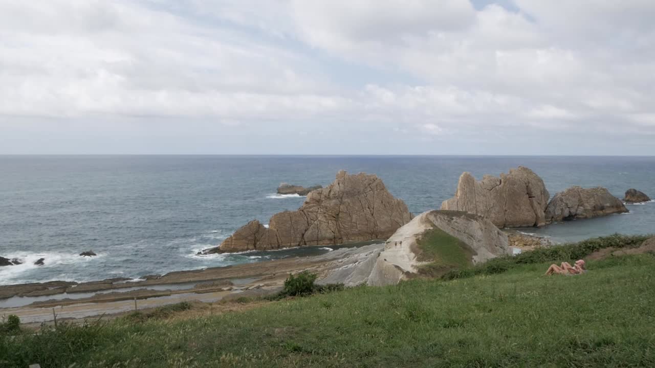 A beautiful view of Arnia Beach, Soto de la Marina, with rocky cliffs and the sea
