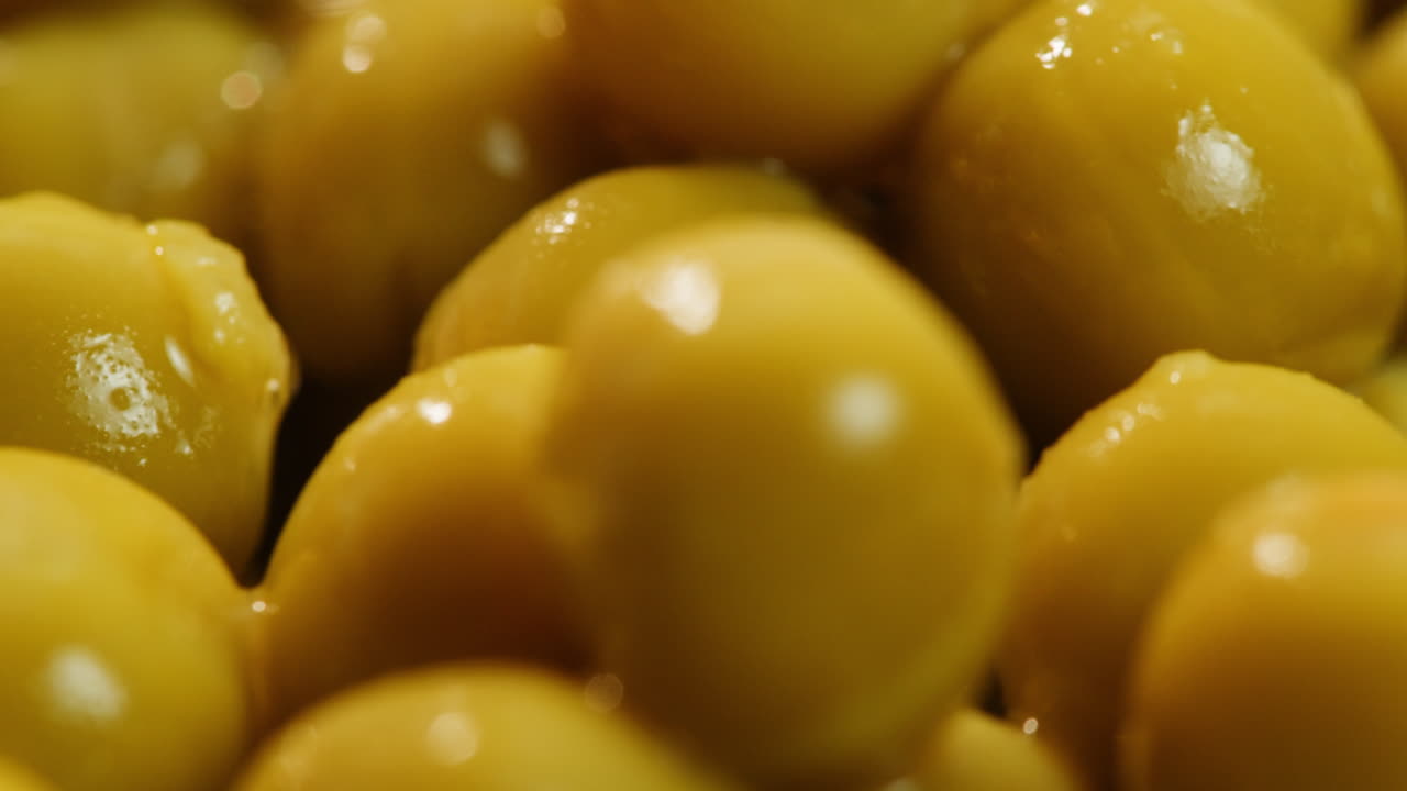 marinated pickled sweet green peas, rotation in circle. Take canned green pea kernels with a fork. High quality 4k footage