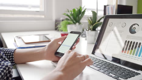 Close-up-of-business-woman-hands--using-digital-tablet-touchscreen-phone-looking-at-finance-data-graphs-planning-responsible-global-solution