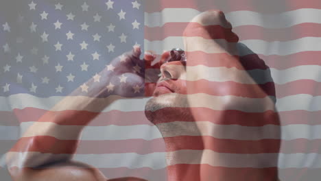 animation of flag of usa over biracial male swimmer