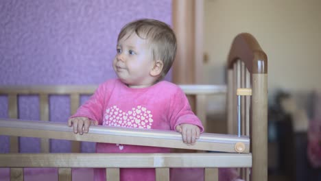 child playing in his bed jumping trying to get out