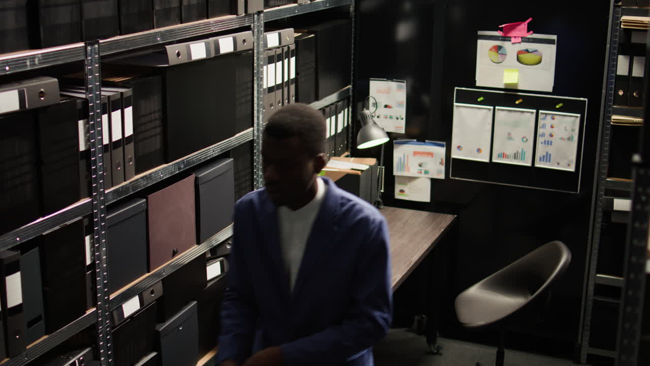 An office worker organizing files in a small office