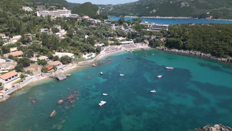 descending drone shot reveals stunning azure waters along rocky beach coastline