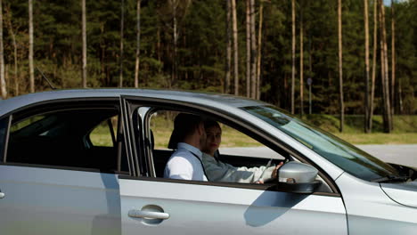 driving school teacher with student