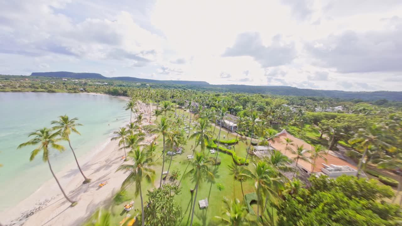 Drone fpv of Playa del Aserradero located in Samaná, Dominican Republic. A beautiful beach offering a serene and natural setting for visitors to enjoy.