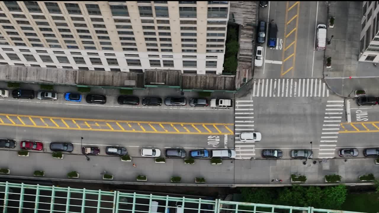 Drone view of busy street with parked cars in New York City