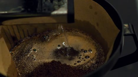 coffee filter with coffee and water running through during the coffee break for a good shot of caffeine