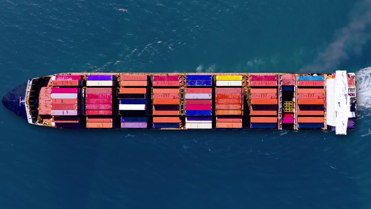 Container ship navigating busy trade routes amidst global supply chain disruptions and shipping delays