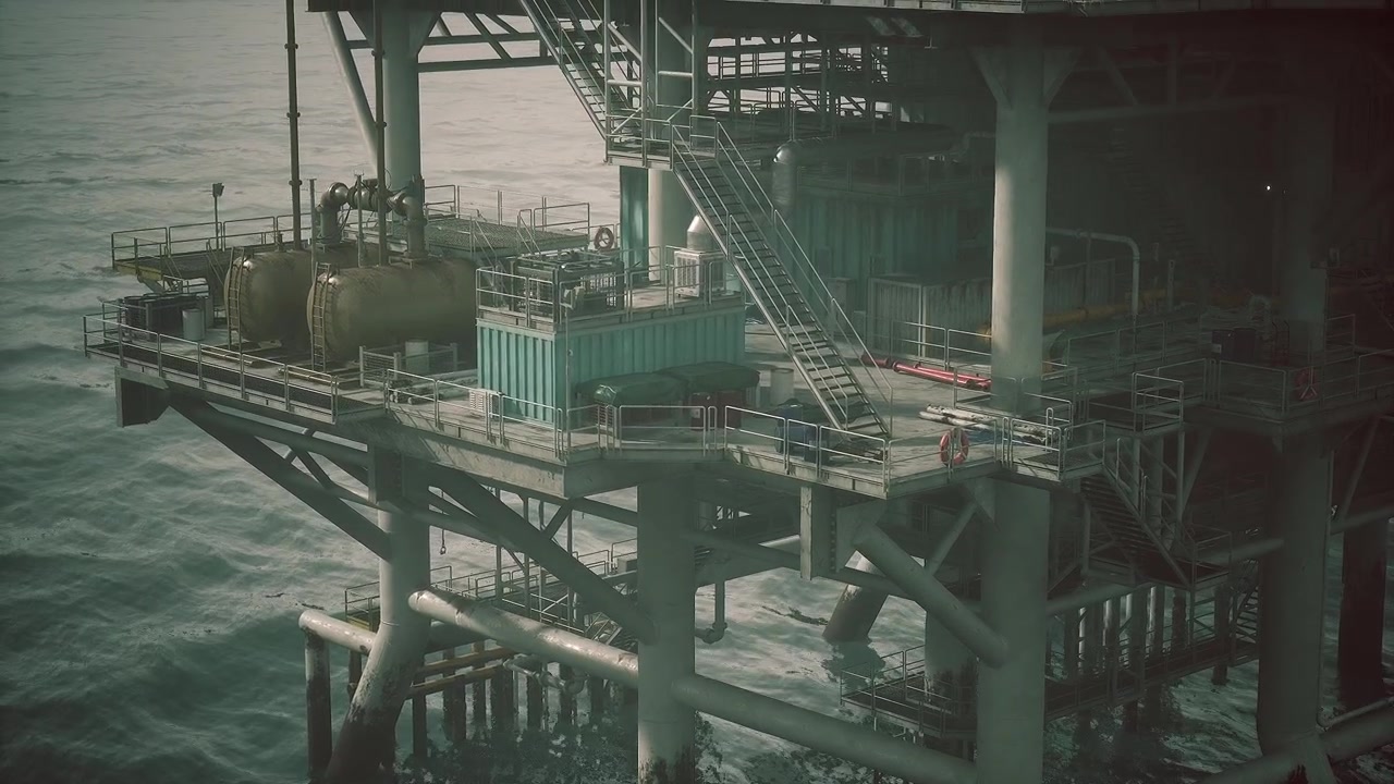 Olieplatform, der står i vandet med industrielt udstyr og trapper.