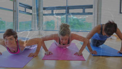 three women performing push-ups in fitness studio, showing digital data chart overlays