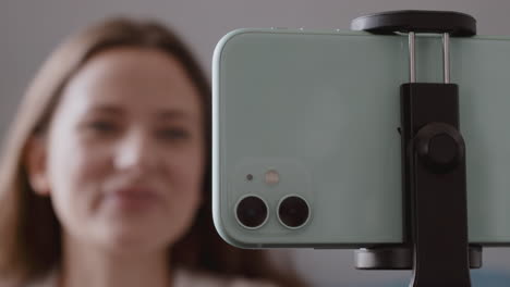 Close-Up-Of-A-Smartphone-Camera-While-Filming-A-Vlogger-Talking-To-Her-Followers