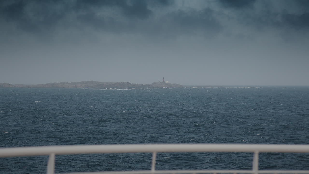 A lighthouse from the distance viewed from the ship