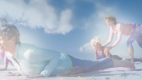 Animation-of-glowing-lights-over-senior-women-exercising-and-clouds-background