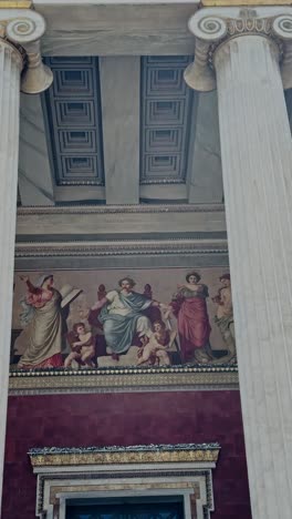 detail of national and kapodistrian university neoclassical facade and murals