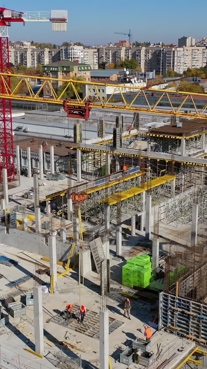 Construction site with cranes. Vertical video
