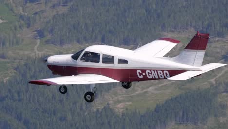 close up shot of a flying piper pa-28 private airplane