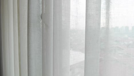 Close-up-of-white-clean-fabric-curtain