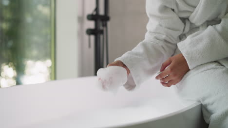 woman relaxing in a luxurious bathtub with bubbles