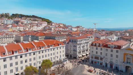 orbit shot of rossio square during traffic time, rua augusta, lisbon