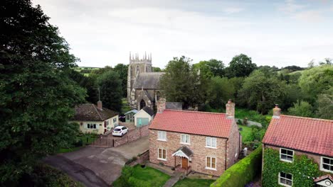 Aerial-video-footage-of-the-remains-of-Bolingbroke-Castle-a-13th-century-hexagonal-castle,-birthplace-of-the-future-King-Henry-IV,-with-adjacent-earthwork