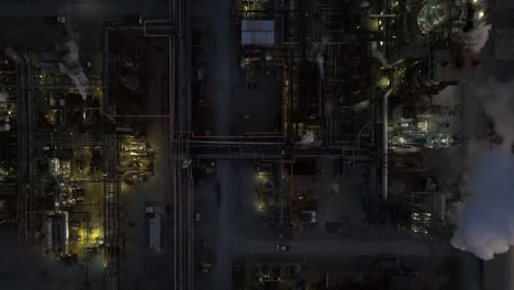 top down aerial of oil refinery at night