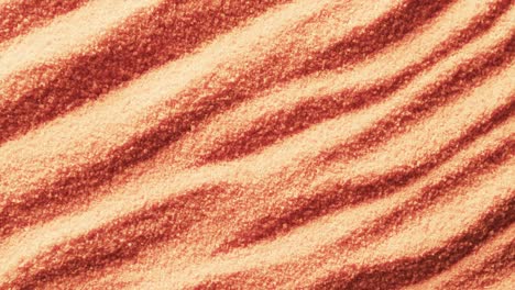 Video-Einer-Nahaufnahme-Von-Orangefarbenem-Sand-Mit-Muster-Und-Kopierraumhintergrund