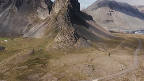 cinematic reveal shot of popular rock formation krossanesfjall, hvalnes