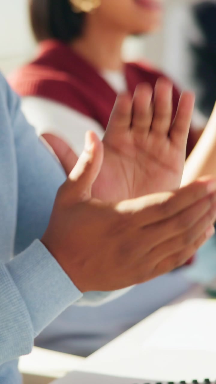 Diverse Group of Professionals Clapping Hands in Office Meeting
