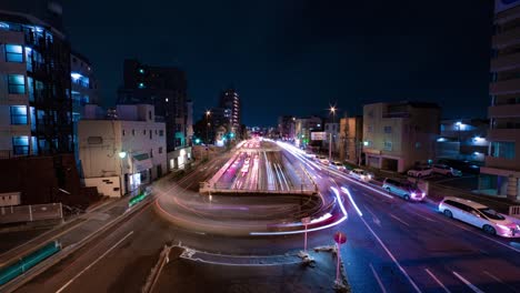 a night timelapse of the traffic jam at the city street in tokyo wide shot