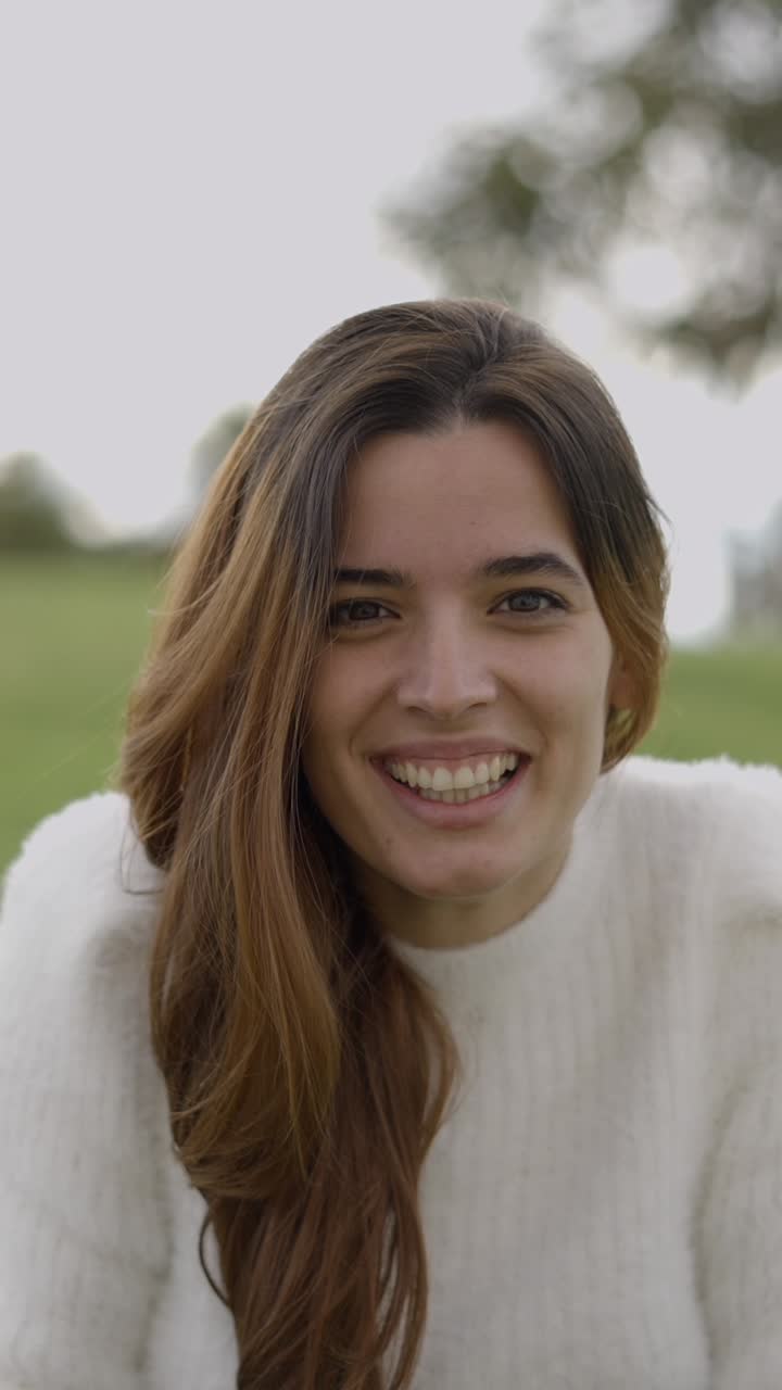 Close-up of a Young Woman Smiling Outdoors