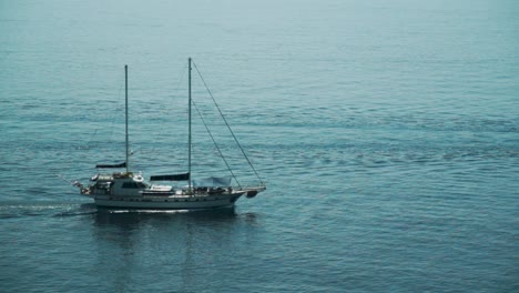 sailing boat towing a dinghy crossing frame