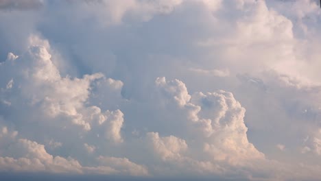 swirling strong winds animate thick fluffy clouds in high the sky