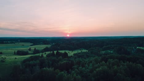 sunset over fields and forests in eastern europe