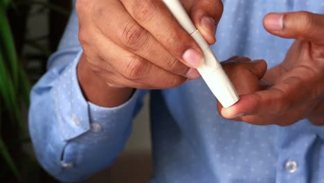 person performing blood sugar test