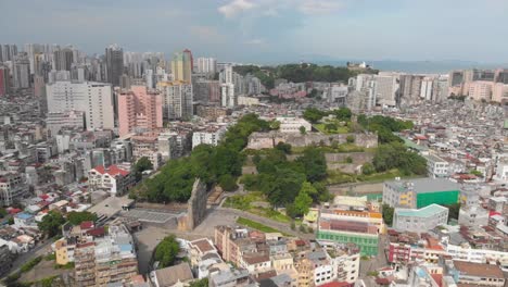 high rotating aerial view of famous ruins of saint paul's and monte do forte, macau