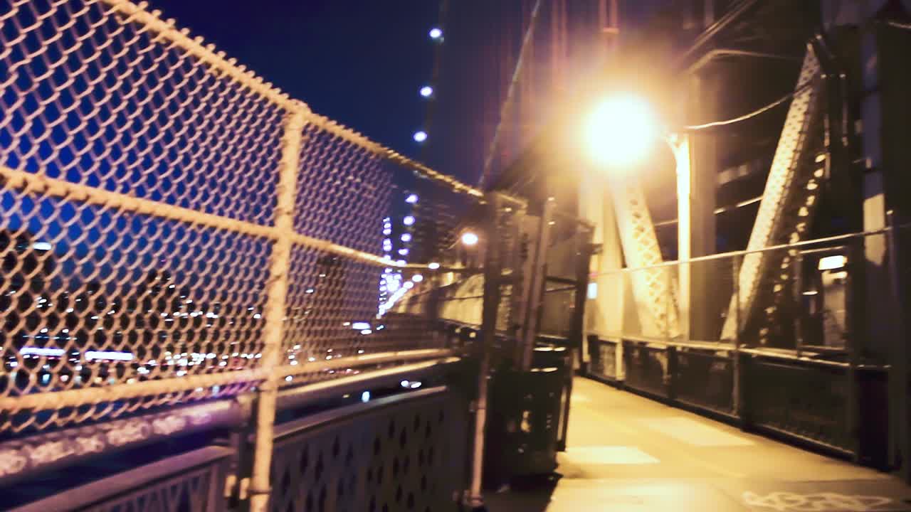 Manhattan Bridge with train moving and Manhattan skyline. Slow motion.
