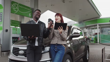 business professionals working at a gas station