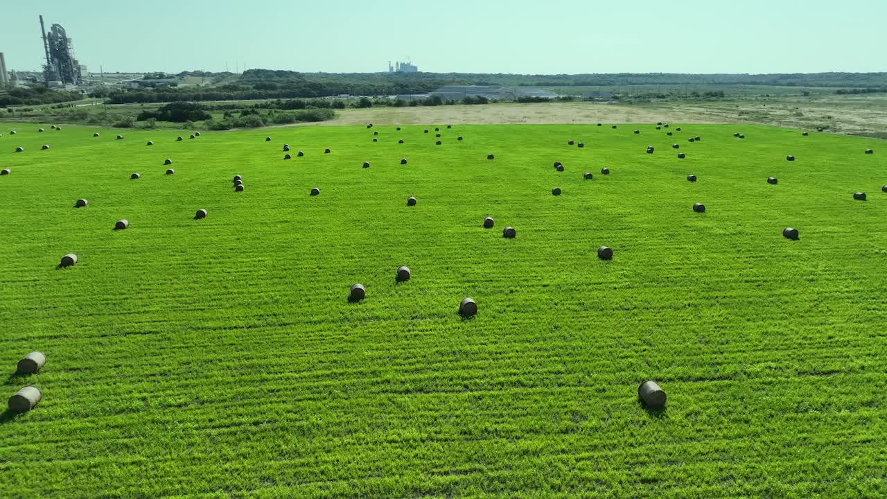drone flying over fields with hay
