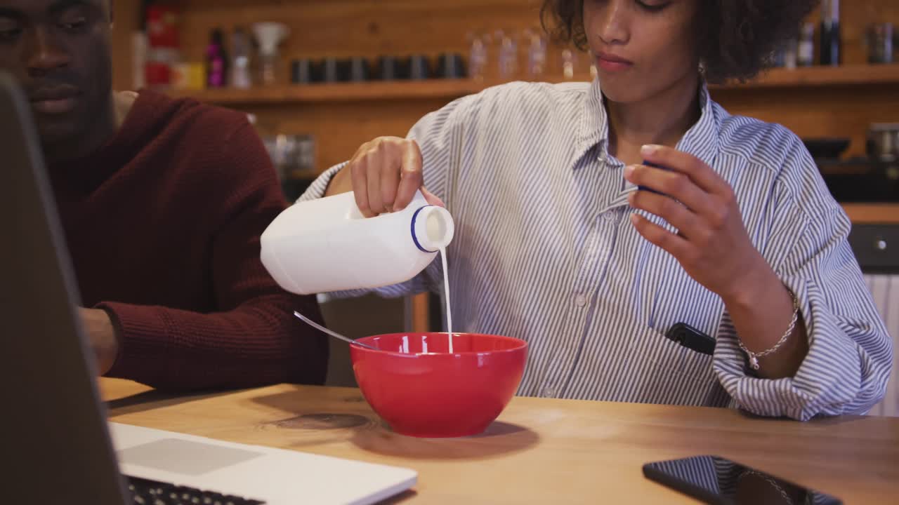 Couple having breakfast at home