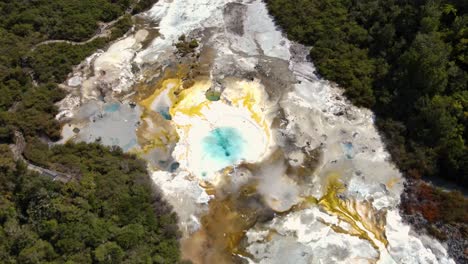 colorful silica terraces at orakei korako thermal park, the hidden valley, north island, new zealand - aerial top down